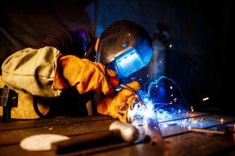 Cutting metal with plasma equipment on plant. Worker cutting metal with plasma equipment. on plant